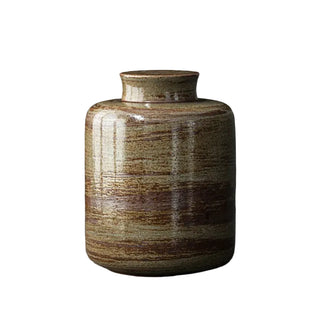 Khaki green ceramic container for storing tea, coffee, sugar and spices.
