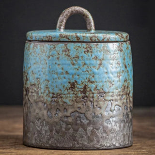 Blue Japanese stoneware storage jar with lid, featuring a rustic finish. Perfect for kitchen organization, this ceramic canister provides airtight storage for tea, coffee, spices, or pantry essentials. A stylish and functional addition to natural homeware and minimalist décor.