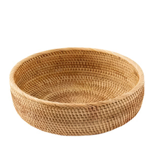 Large round handwoven natural rattan storage basket, ideal for organising or serving snacks in an eco-friendly home.