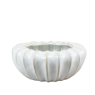 White ceramic pod bowl with fluted detailing and glossy glaze.
