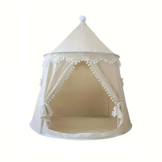Large indoor and outdoor kids play tent in beige with pom-pom trim, styled with house-shaped cushions inside, creating a cosy reading and play nook.