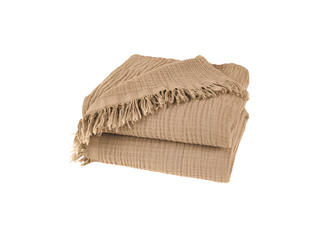 Nori Latte Cotton Gauze Throw – soft and lightweight natural blanket with textured weave and fringed edges. Perfect for layering over a bed or sofa for a relaxed, cozy and lived-in look.