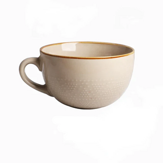 Large hand-painted ceramic beige mug with dotted pattern, glossy finish, and vibrant colour, ideal for hot drinks, soup, or cereal.