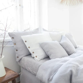 Light grey pure linen fitted sheet styled with matching pillows and duvet - perfect for modern, boho, scandi and minimalist bedrooms.