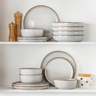 Stackable stoneware plates and bowls for contemporary dining.