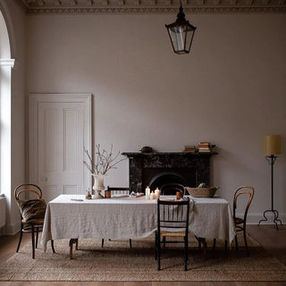 Large soft grey linen tablecloth styled for calm, minimalist interior.