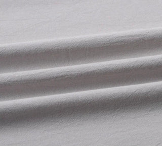 Light grey cotton table linen with soft airy texture.