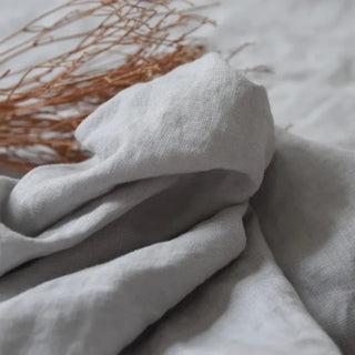 Stone washed light grey linen curtain fabric with soft texture.