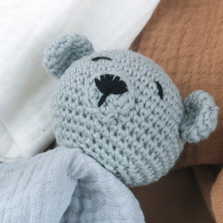 Handmade Little Bear crochet comforter made from organic cotton gauze, resting softly on a neutral background—perfect for newborn snuggles.