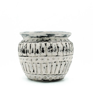 White ceramic pot with black textured patterns on a white background