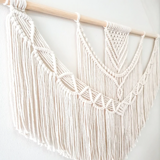 Handmade macrame wall hanging – a beautifully crafted natural home decor piece. Featuring intricate knot patterns and tassel details, this boho-inspired wall art adds texture and warmth to any space. Perfect for modern, rustic, or Scandinavian interiors. Ideal for living rooms, bedrooms, or entryways. 