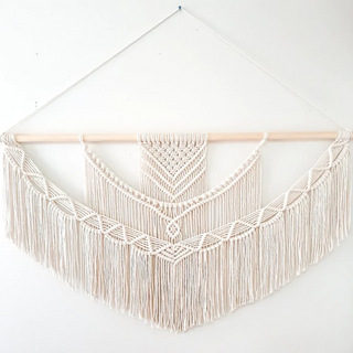 Handmade macrame wall hanging – a beautifully crafted natural home decor piece. Featuring intricate knot patterns and tassel details, this boho-inspired wall art adds texture and warmth to any space. Perfect for modern, rustic, or Scandinavian interiors. Ideal for living rooms, bedrooms, or entryways. 