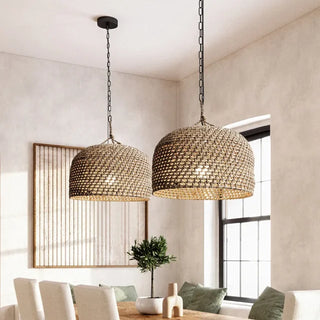 Handwoven natural hemp pendant light with a warm ambient glow, perfect for coastal, boho, or modern interiors. Hung as a pair above a dining table