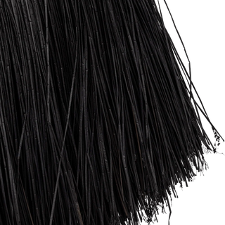 Sculptural black woven wall decor with a circular frame and fringed natural fibres