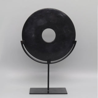 Black marble disc ornament with natural veining, mounted on a sleek minimalist metal stand — perfect for modern organic and sculptural home styling.
