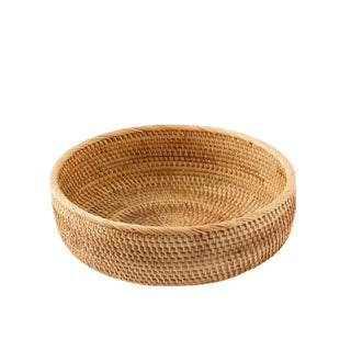 Medium round handwoven natural rattan storage basket, ideal for organising or serving snacks in an eco-friendly home.