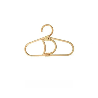 Handmade rattan clothes hangers for kids with woven boho design, nursery-sized and eco-friendly