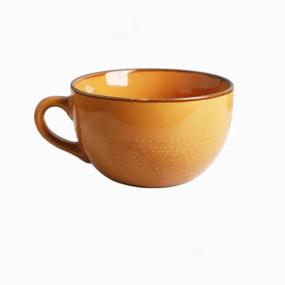 Large hand-painted mustard yellow ceramic mug with dotted pattern, glossy finish, and vibrant colour, ideal for hot drinks, soup, or cereal.