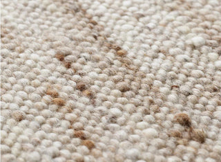 Anvi handmade wool and linen rug in beige earthy tones, featuring a bubbly textured surface - ideal for Scandi, minimalist, or modern interiors.