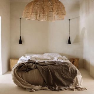 Endah Handwoven Natural Rattan Pendant Lampshade – interwoven in a creative, organic shape, this ceiling light  is a statement piece, perfect for natural home decoration. This hanging lamp comlements boho, Scandi, coastal and Wabi-Sabi aesthetics, adding warmth and texture to any space. Ideal for eco-conscious interiors.