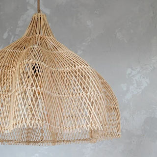 Endah Handwoven Natural Rattan Pendant Lampshade – interwoven in a creative, organic shape, this ceiling light  is a statement piece, perfect for natural home decoration. This hanging lamp comlements boho, Scandi, coastal and Wabi-Sabi aesthetics, adding warmth and texture to any space. Ideal for eco-conscious interiors.