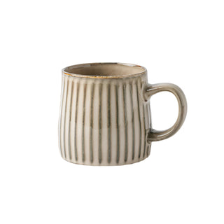 Handmade ceramic ribbed mug in natural earthy tones. Rustic, high-quality ceramic mug for coffee or tea lovers.