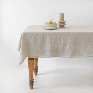 Natural linen tablecloth with ceramic dinnerware.