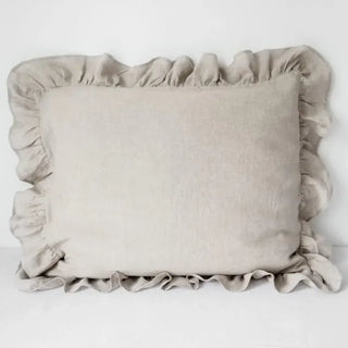 Natural ruffled linen pillowcase in white, made from 100% flax linen, styled on a soft neutral bed – available in multiple colours and sizes from Arkaim Home