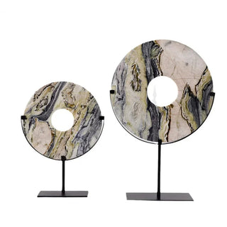 Marble disc ornaments on minimalist metal stands available in two sizes.