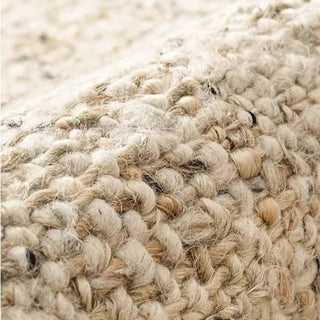 Nordic handmade wool and jute rug with a natural, heathered texture in neutral tones—ideal for minimalist and earthy home decor.