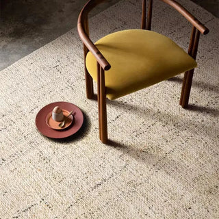 Nordic handmade wool and jute rug with a natural, heathered texture in neutral tones—ideal for minimalist and earthy home decor.