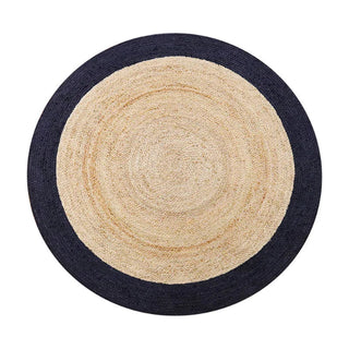 Handmade round reversible jute rug with a natural beige center and a contrasting navy border, hand-braided in India from 100% natural jute.