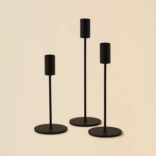 Black metal candle holders for minimalist interiors.