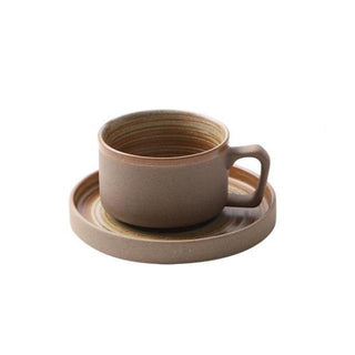 Miri stoneware mug and saucer set with spiral pattern in speckled oatmeal glaze, styled for modern and rustic tableware. Perfect for milk, tea, or coffee.