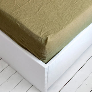 Olive green pure linen fitted sheet — breathable natural linen bedding, textured and soft, ideal for year-round comfort. Available in multiple colours and sizes at Arkaim Home. Perfect for modern, boho, Scandinavian, and wabi-sabi bedroom styles.