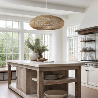 Melati oval rattan ceiling light hanging above a kitchen island.