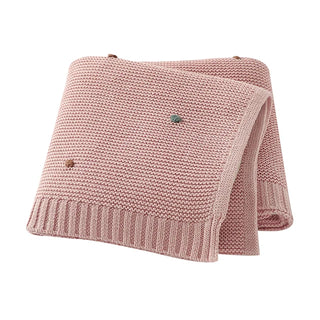 Bibi Cotton Knit Baby Blanket in soft pastel pink, folded neatly.