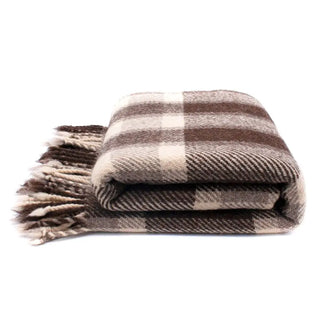 Plaid wool blanket with a fringe in cream and brown.