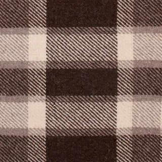 Plaid blanket with brown and beige colours and fringed edges for calm rustic interiors.