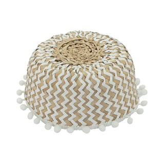 Handwoven natural and white seagrass storage basket with handles, perfect as a stylish hanging basket, pot planter, or decorative storage solution. This eco-friendly, two-tone basket adorned with charming pom poms adds a touch of natural boho touch while keeping your space organized. Shop handcrafted storage baskets at our natural homeware store.