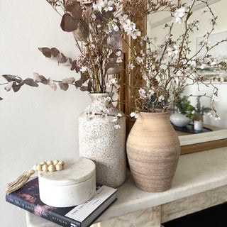 Handmade terracotta ceramic vase with textured finish for modern decorative styling. 