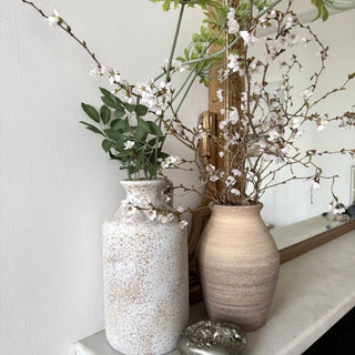 Handmade terracotta ceramic vase with textured finish for modern decorative styling. 