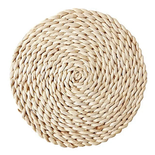 Natural round handwoven corn husk placemats and coasters, eco-friendly and heat-resistant for stylish table protection.