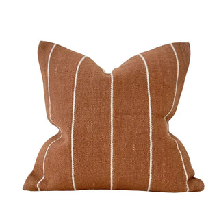 Rust orange striped cotton cushion with textured weave.