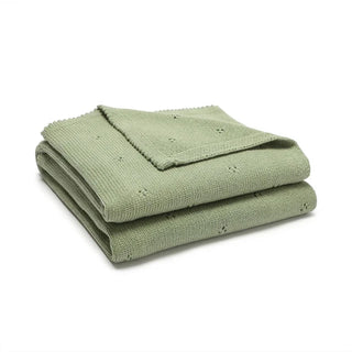 Gigi cotton knit baby blanket folded in soft sage green.