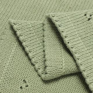 Gigi cotton knit baby blanket in soft sage green.
