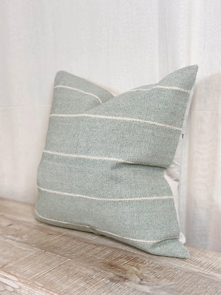 Light green and cream stripe cushion for living room and bedroom styling.