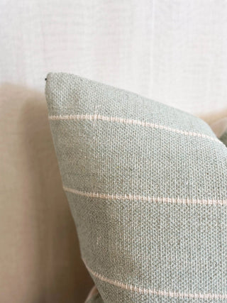 Textured cotton cushion cover for layered interior styling.