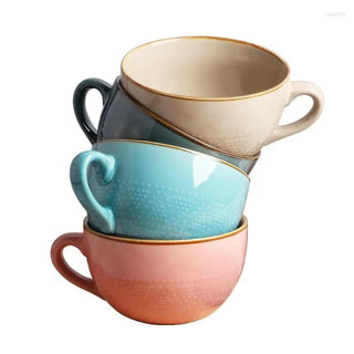 Large hand-painted ceramic mugs in beige, coral and blue with dotted pattern, glossy finish, and vibrant colour, ideal for hot drinks, soup, or cereal.