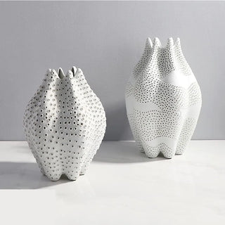 Abstract white ceramic vases for modern and minimalist interiors.